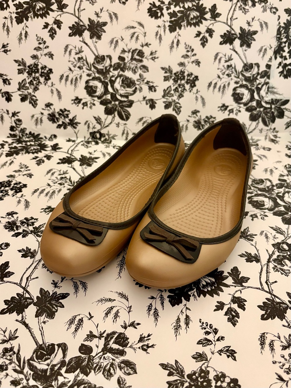 CROCS Women's Tan Ballet Flats with Black Trim and Bow